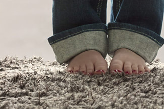 Childs feet on new carpet